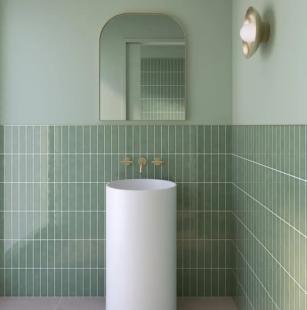 A Modern Bathroom With a White Pedestal Sink — Stone Arc in Kincumber, NSW