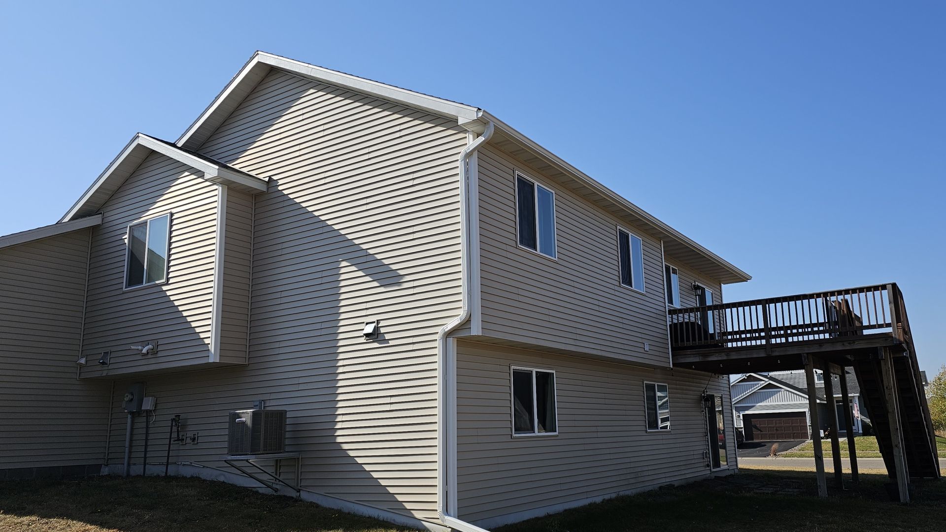 The back of a house with a deck and stairs