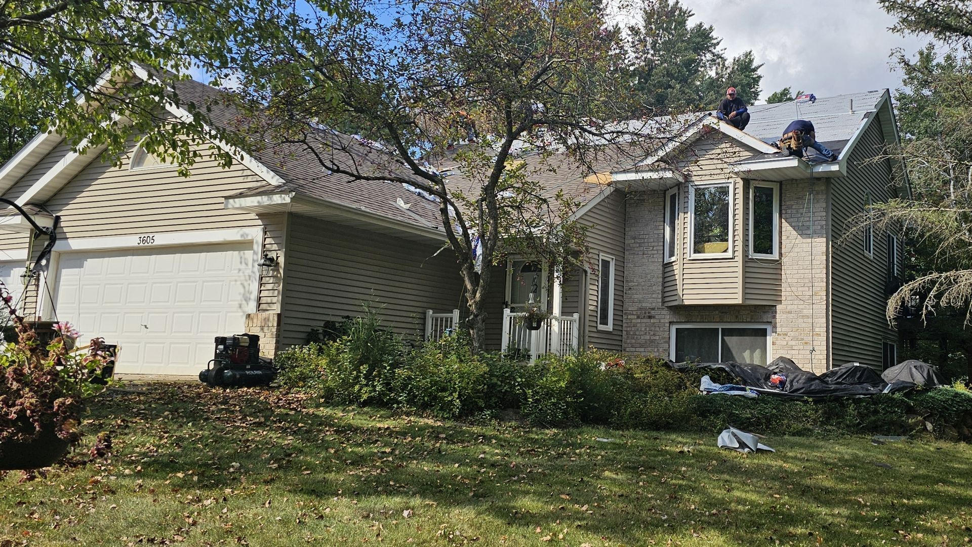 A house with a roof that is being repaired.