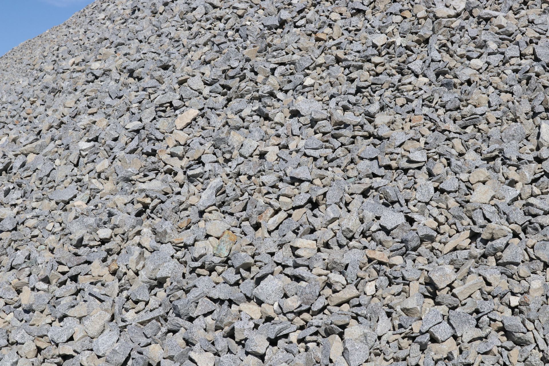 A pile of gravel is sitting on top of a hill.