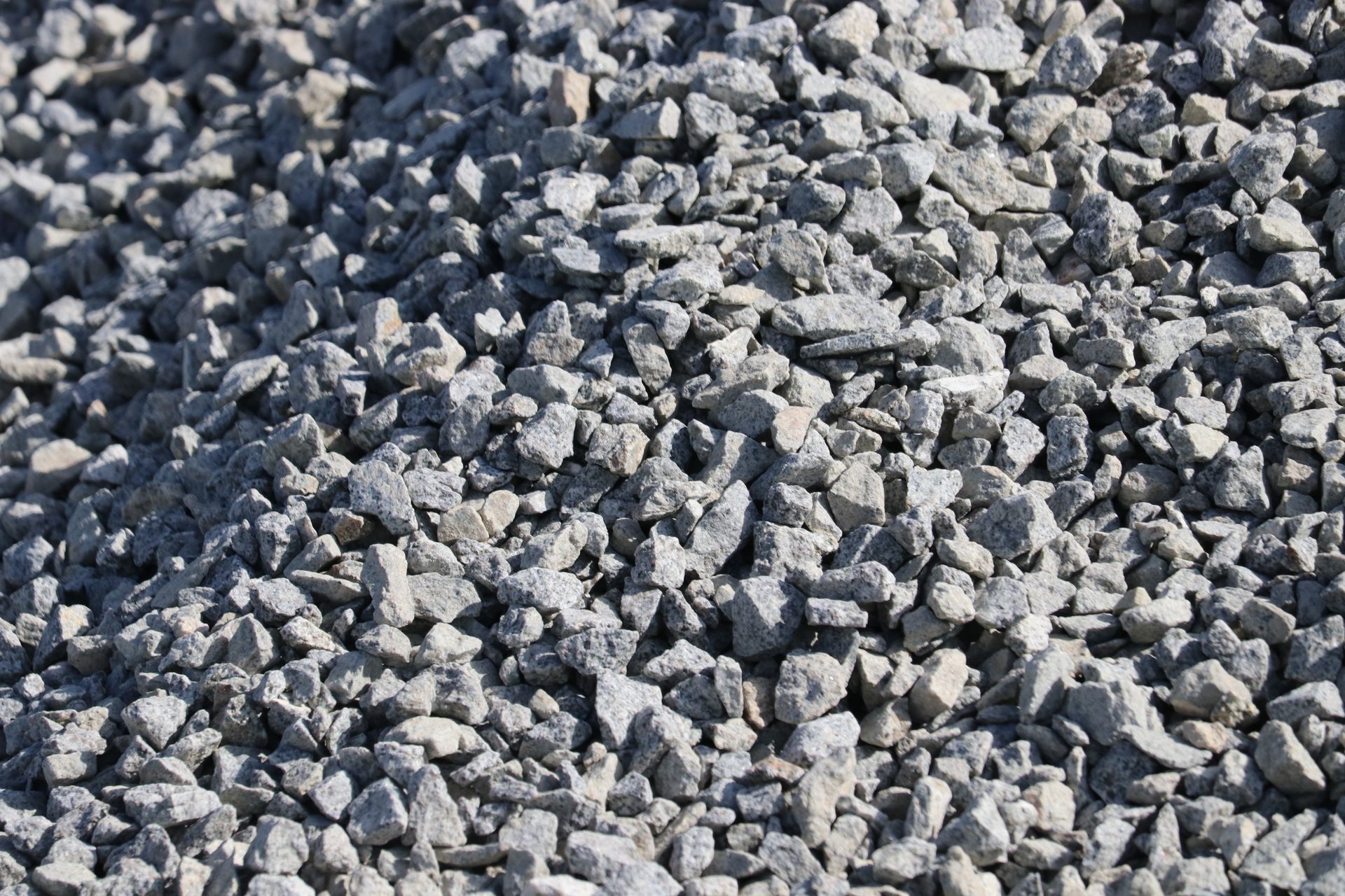 A pile of gravel is sitting on the ground.