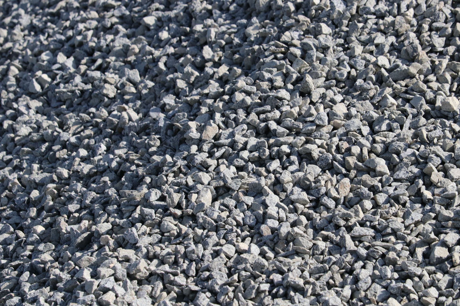 A pile of gravel is sitting on the ground.