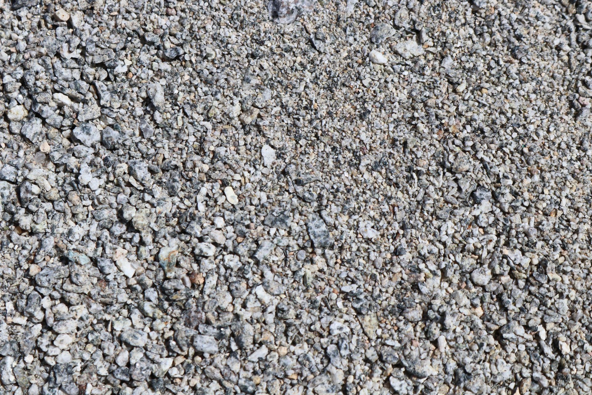A pile of gravel is sitting on the ground.