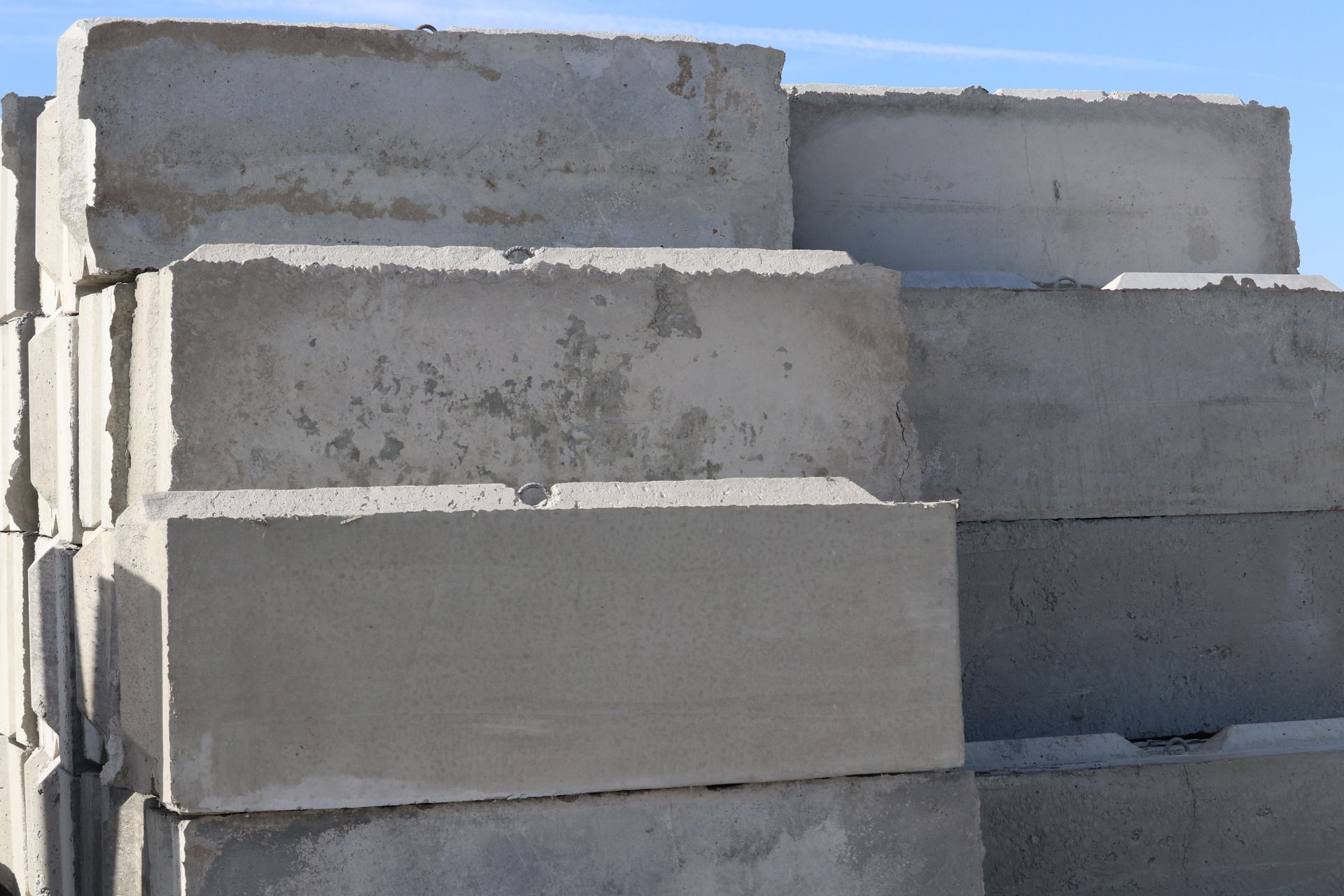 A pile of concrete blocks are stacked on top of each other.