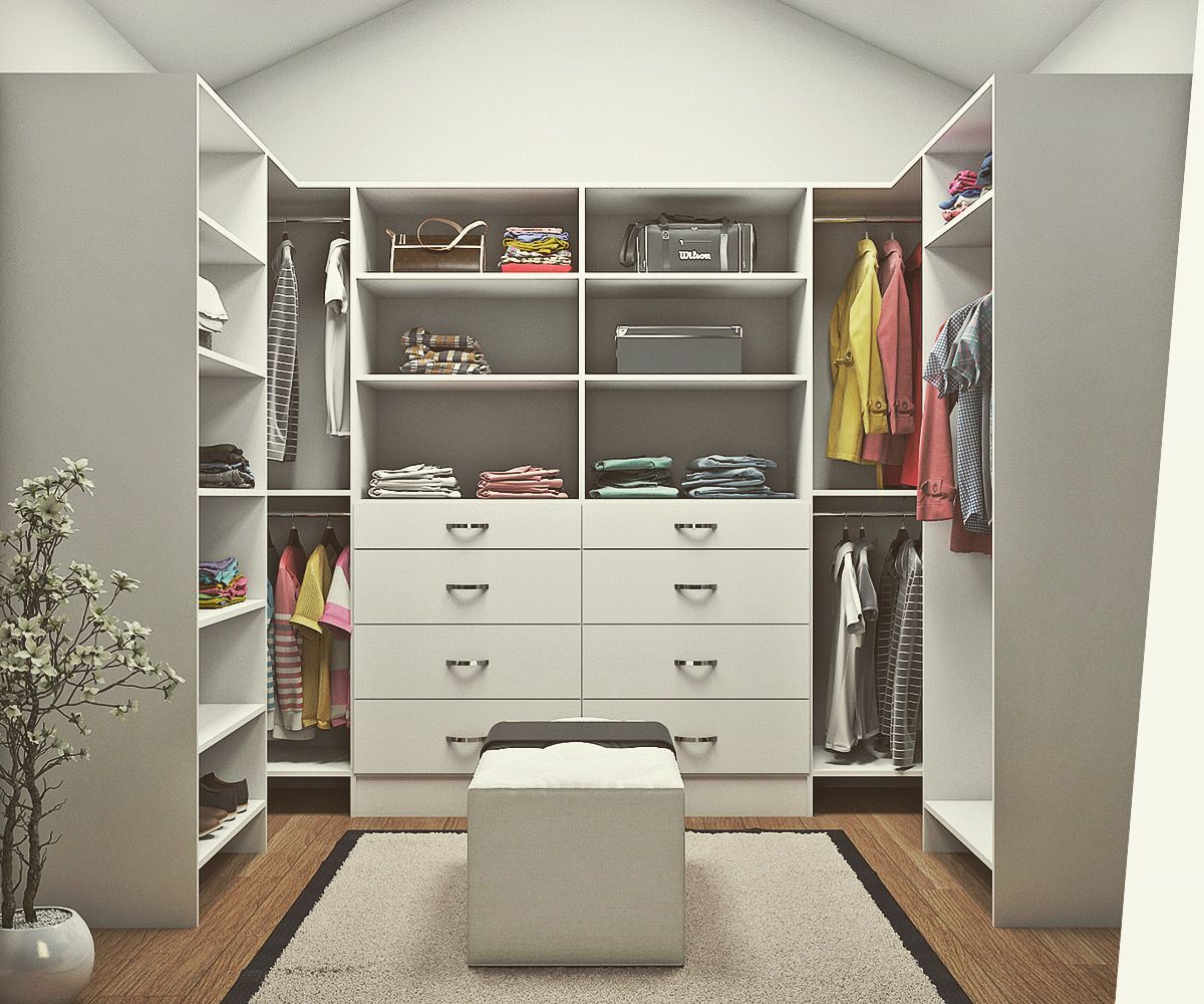 White walk-in closet with shelves, drawers, hanging rods, and a bench; clothes and accessories are visible.