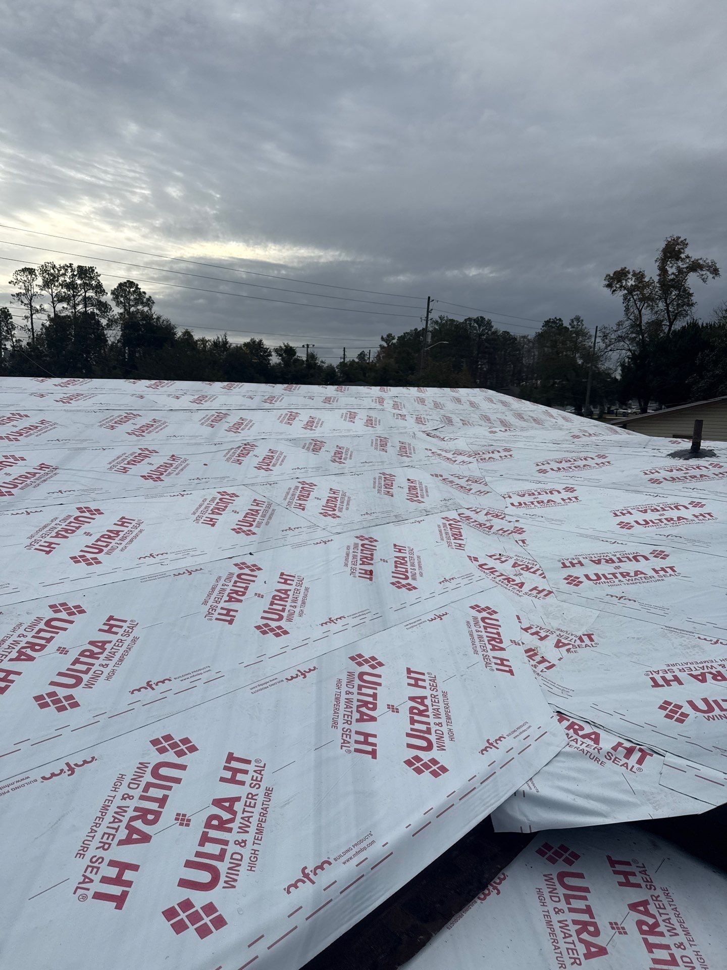 White roofing material labeled 