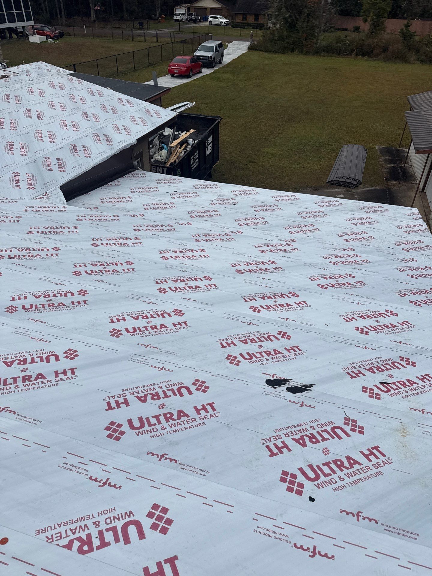 Roof with white underlayment marked 