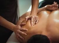 Massage therapist giving a shoulder massage.
