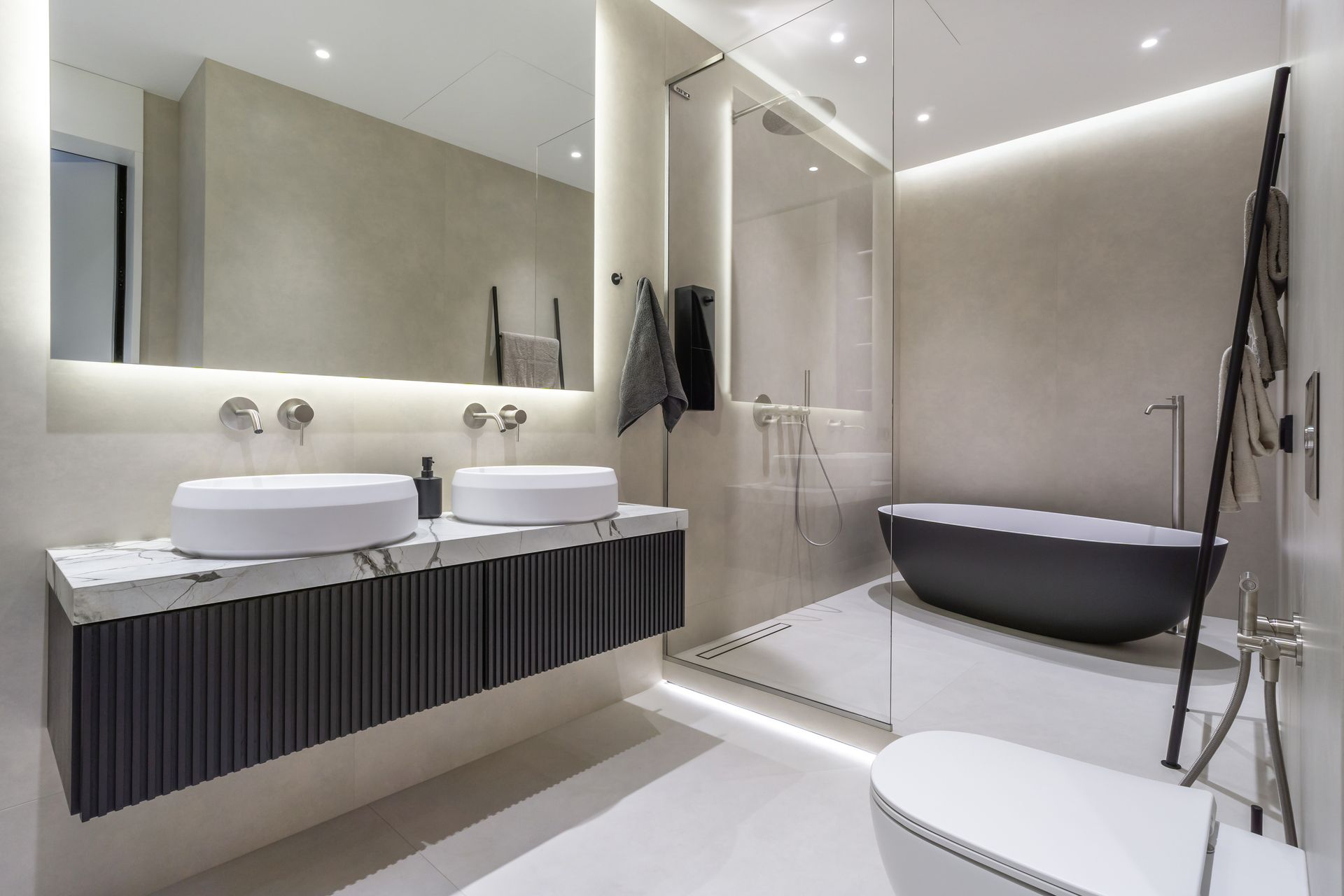 Modern bathroom with double sink vanity, freestanding bathtub, and glass shower in a bright minimalist design Modern bathroom with double sink vanity, freestanding bathtub, and glass shower in a bright minimalist design