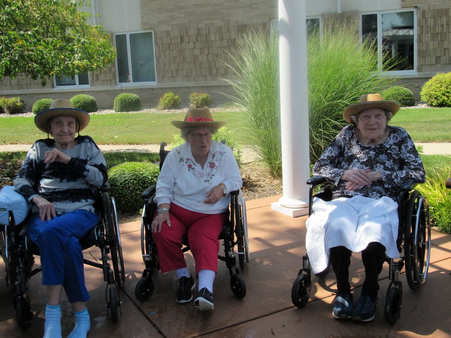 Elders sitting outside and socializing at Lenawee Medical Care Facility in Adrian, MI