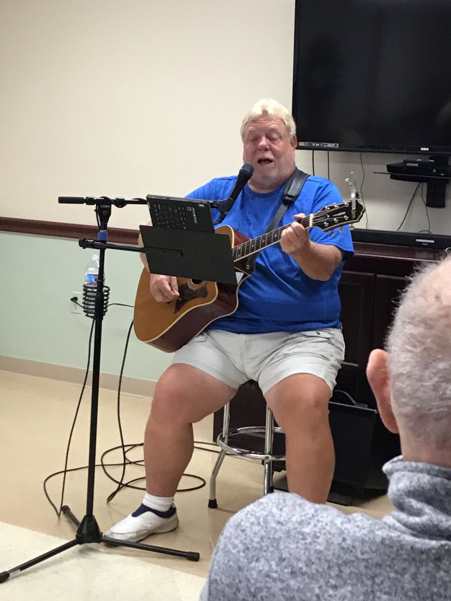 Man playing guitar during concert at Lenawee Medical Care Facility in Adrian, MI