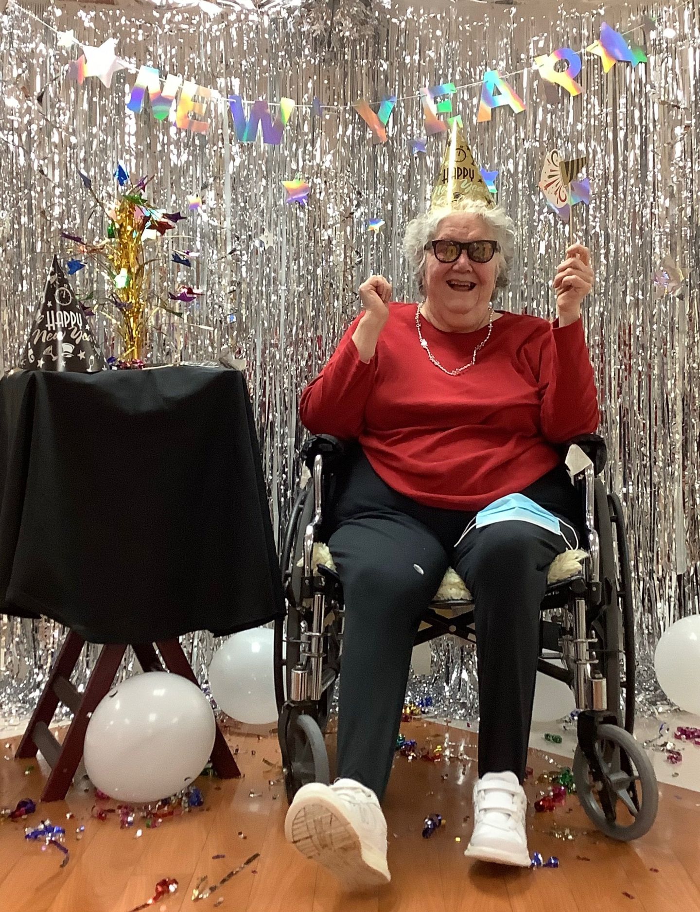Elder celebrating New Years with decorations at Lenawee Medical Care Facility in Adrian, MI
