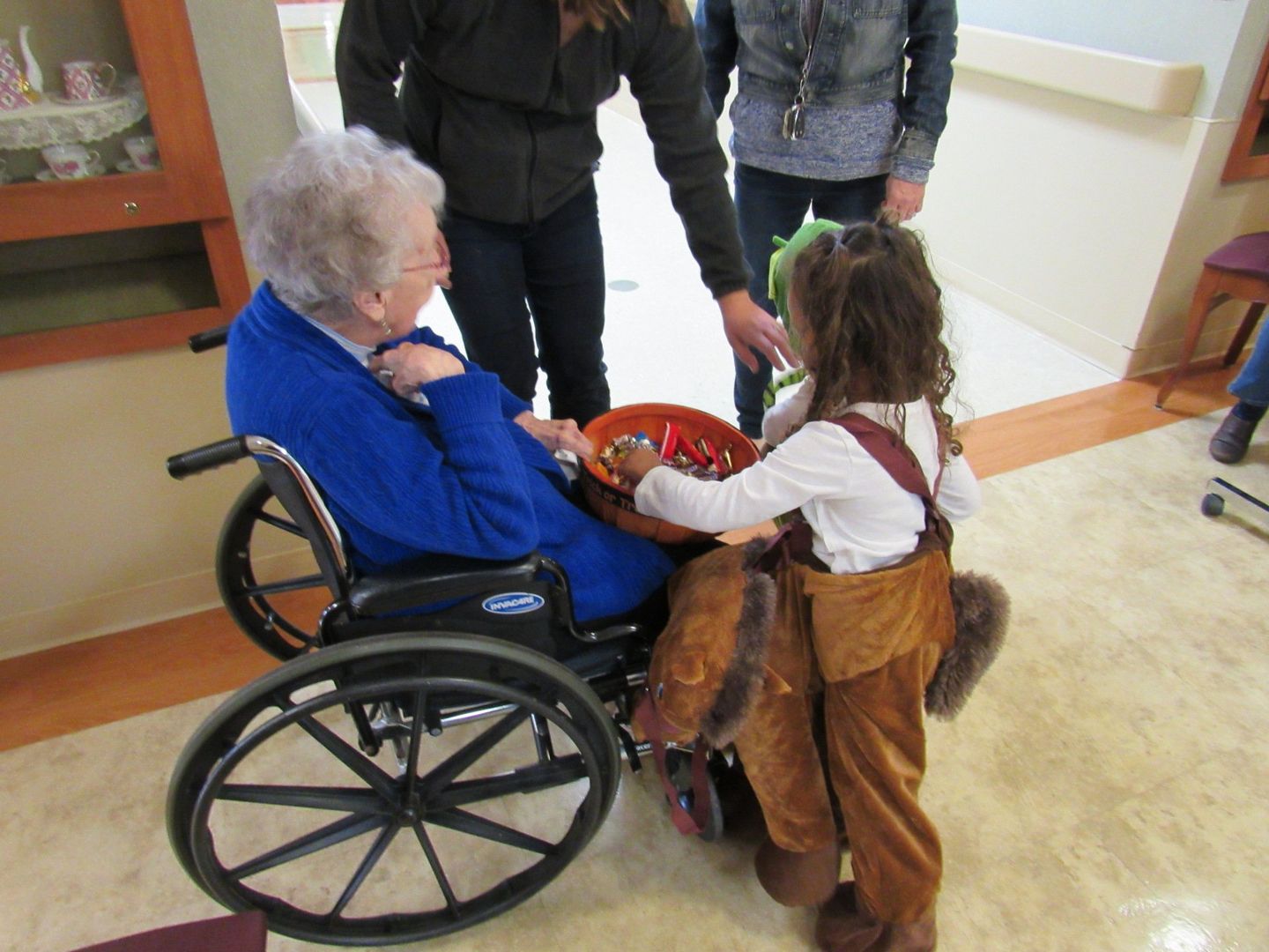 Elder handing out candy at Halloween at Lenawee Medical Care Facility in Adrian, MI