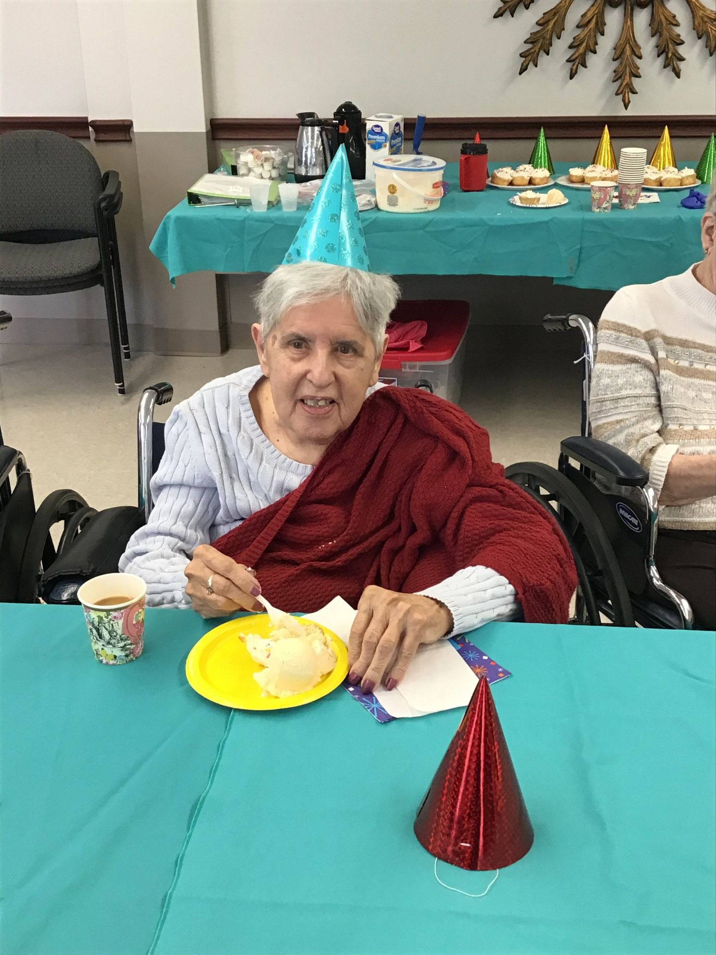 Elder eating cake at party at Lenawee Medical Care Facility in Adrian, MI