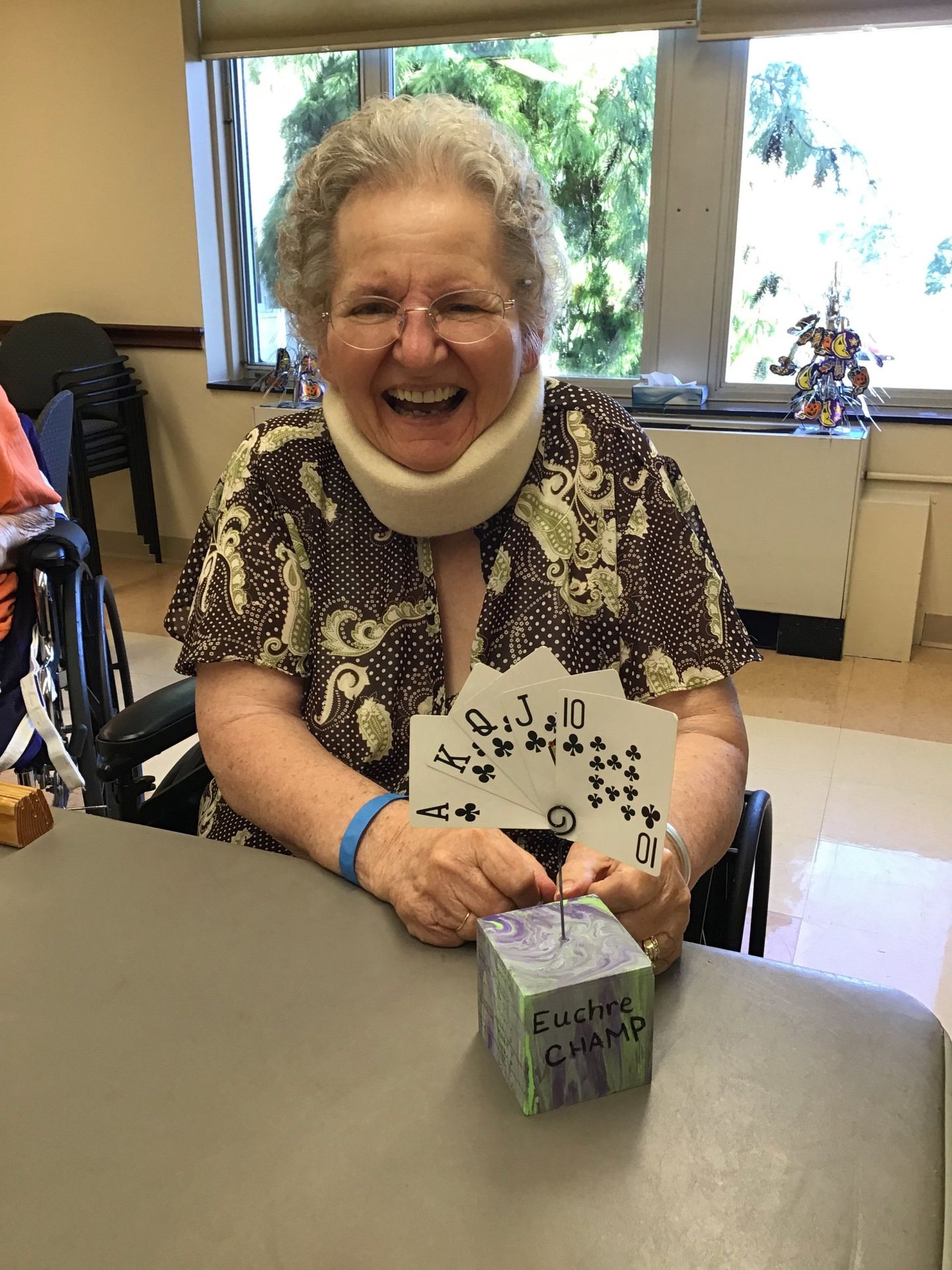Elder with a Euchre Champ Trophy at Lenawee Medical Care Facility in Adrian, MI
