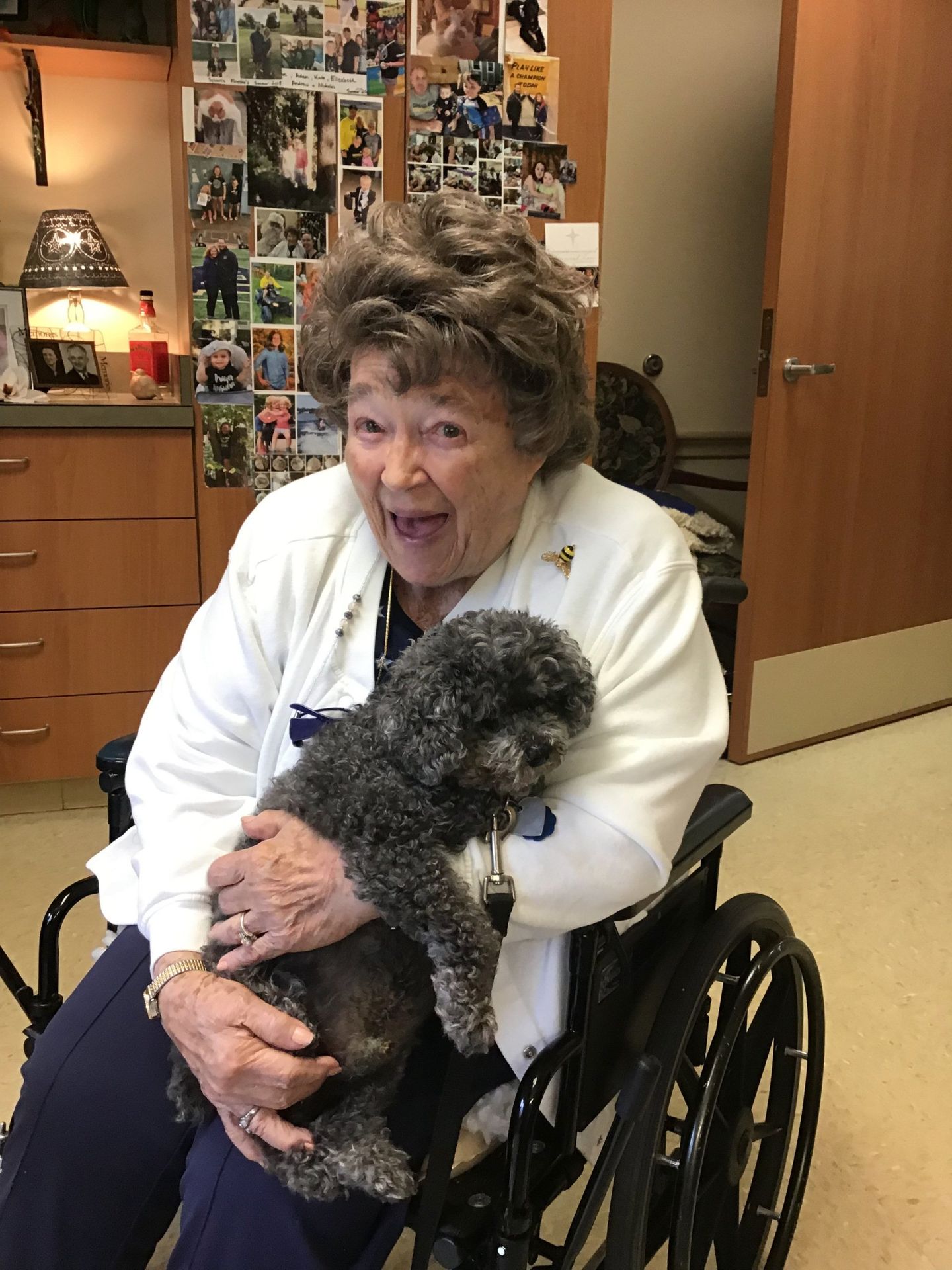 Elder holding dog in her room at Lenawee Medical Care Facility in Adrian, MI