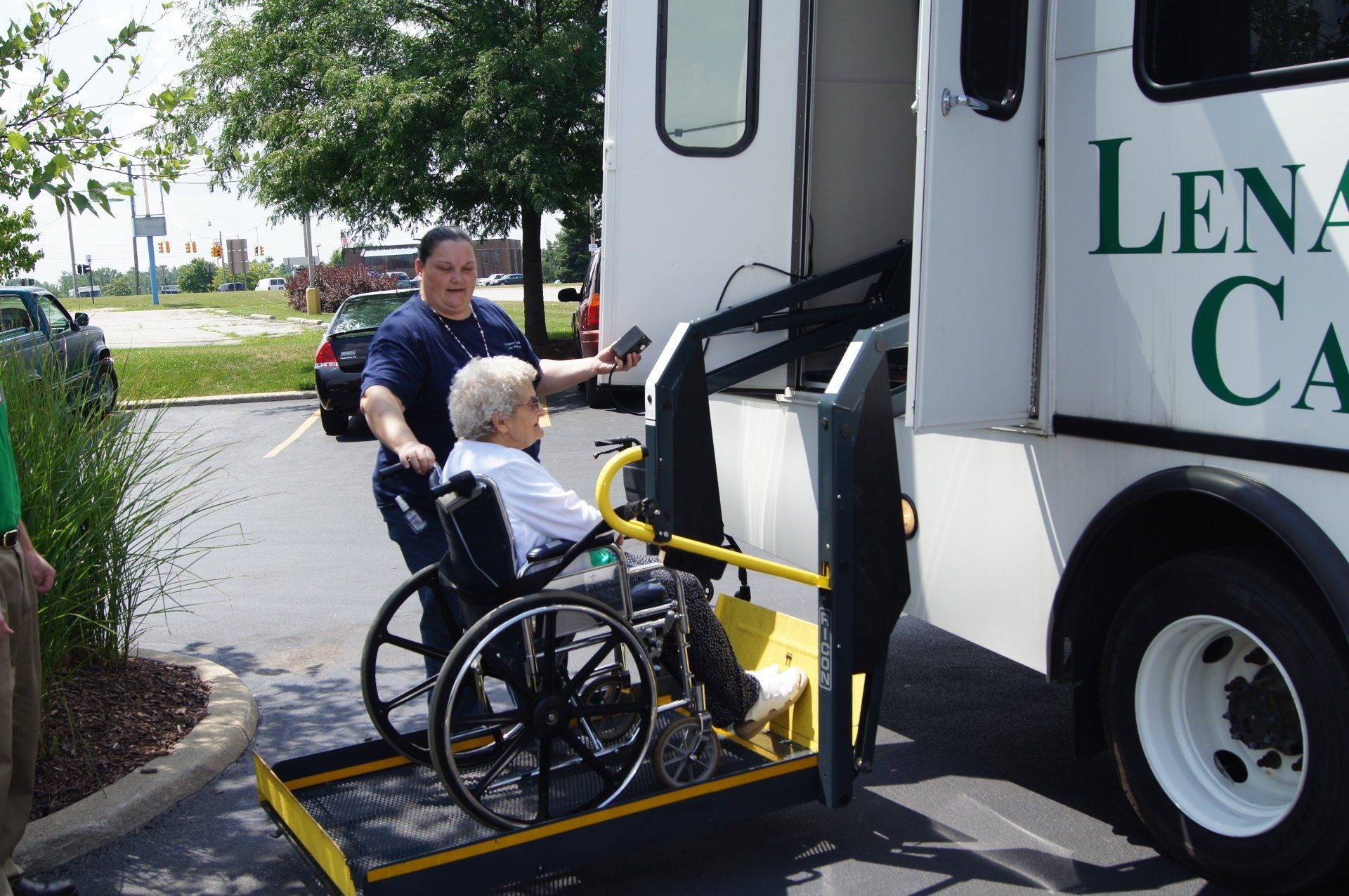 Nurse Helping Elder get on Bus during a Field Trip at Lenawee Medical Care Facility in Adrian, MI