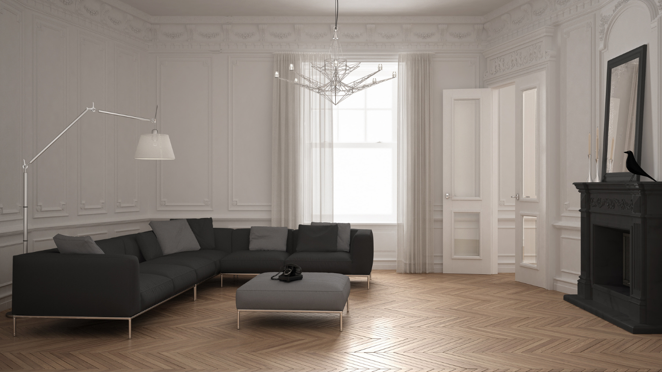 A modern living room with a black sectional sofa, light wood floor, and a dark fireplace.