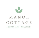 Manor Cottage Beauty and Wellness logo with green leaf icon and gray text on white background