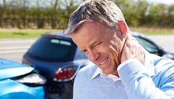 Man with neck pain after accident — Chiropractic care in Spokane, WA Man with neck pain after accident — Chiropractic care in Spokane, WA