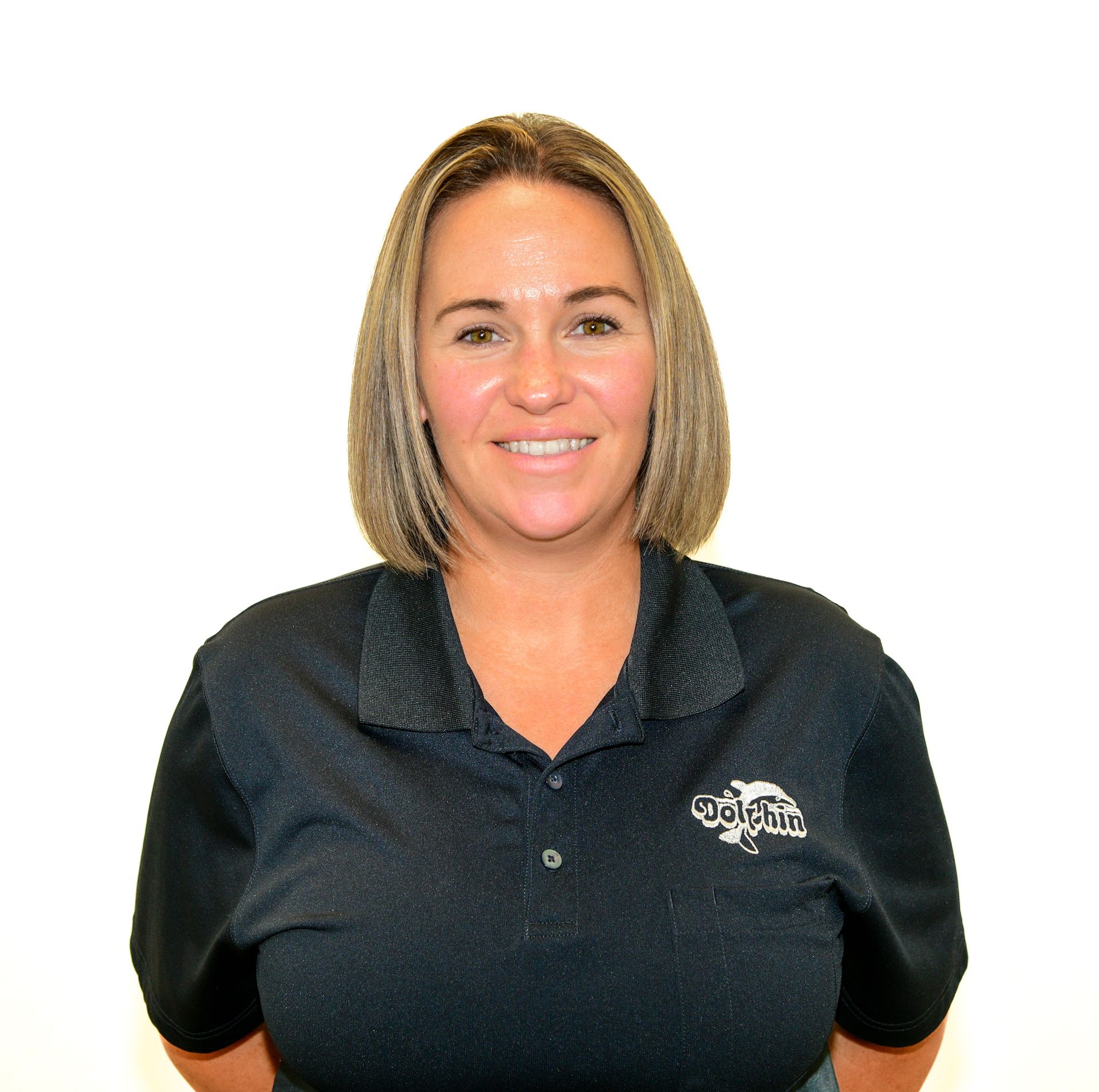 A woman with her arms crossed is wearing a shirt with a zebra on it