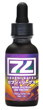 Bottle of Seven Leaves broad spectrum CBD tincture, black glass, purple label, dropper.