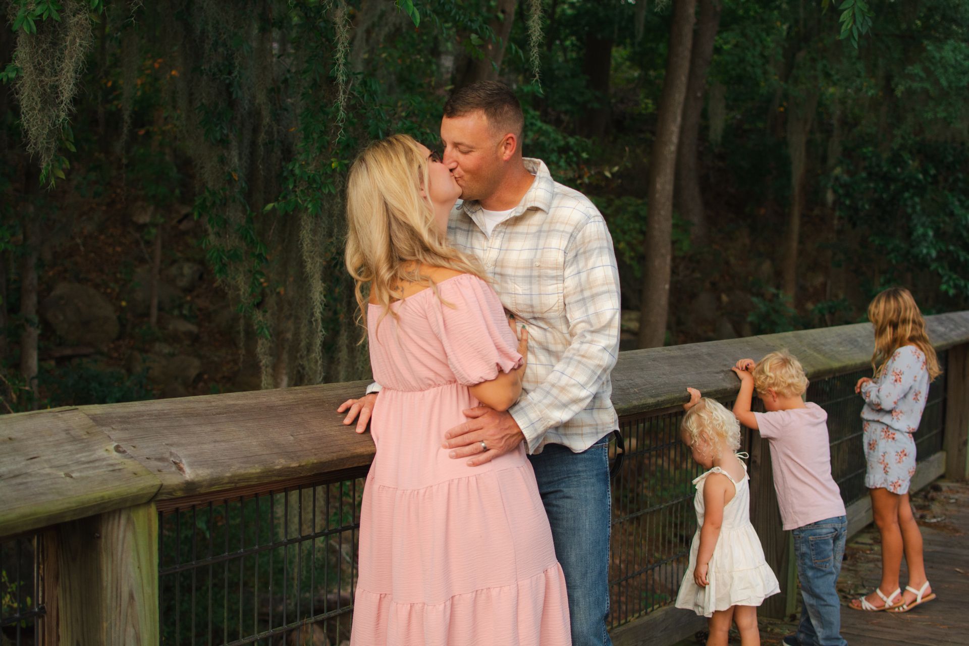 A family of 5 at the Saluda Riverwalk, SC for family portraits. 
