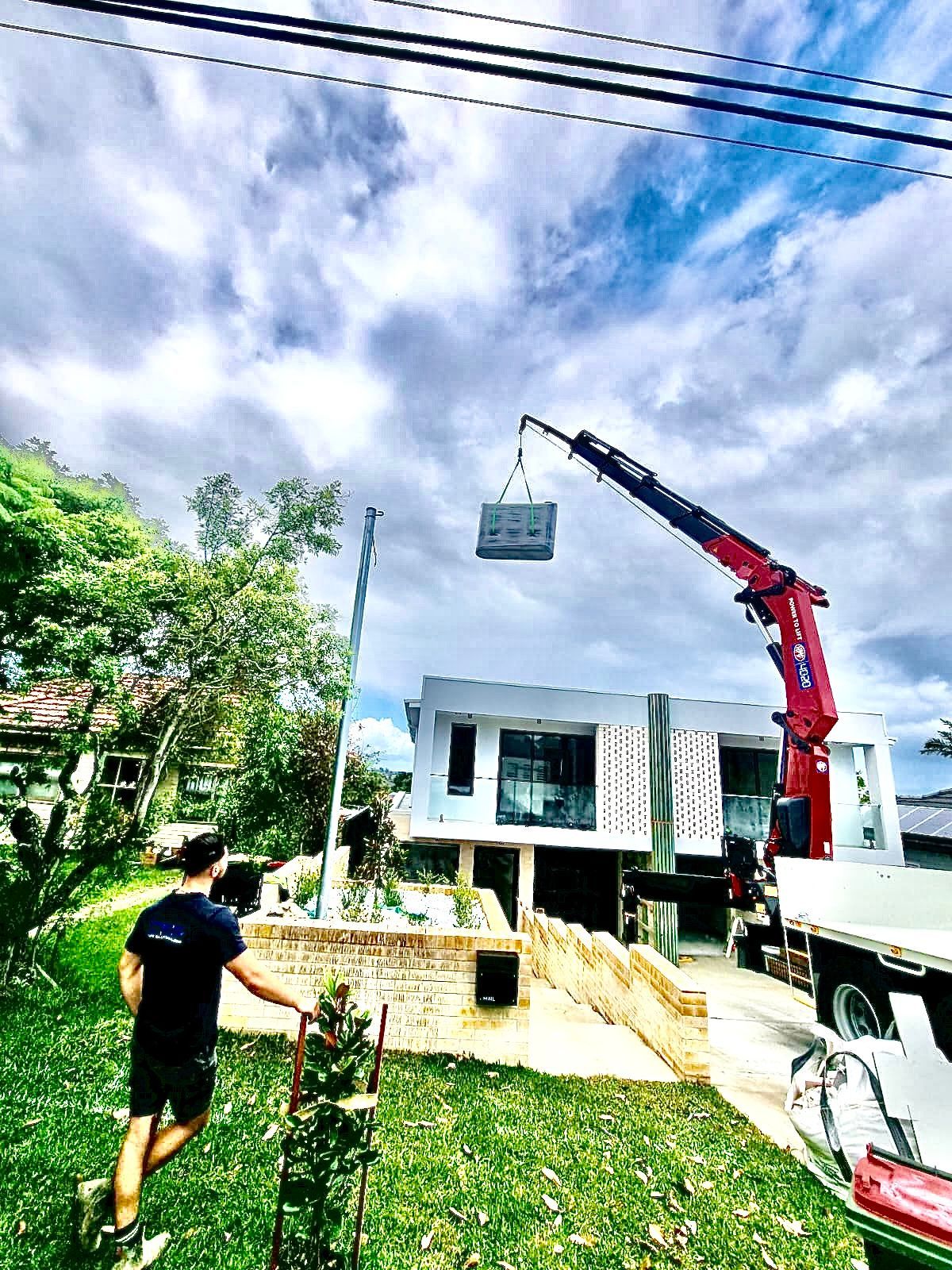 Water Storage Lifting on Roof — Sydney, NSW — Level8 Cranes