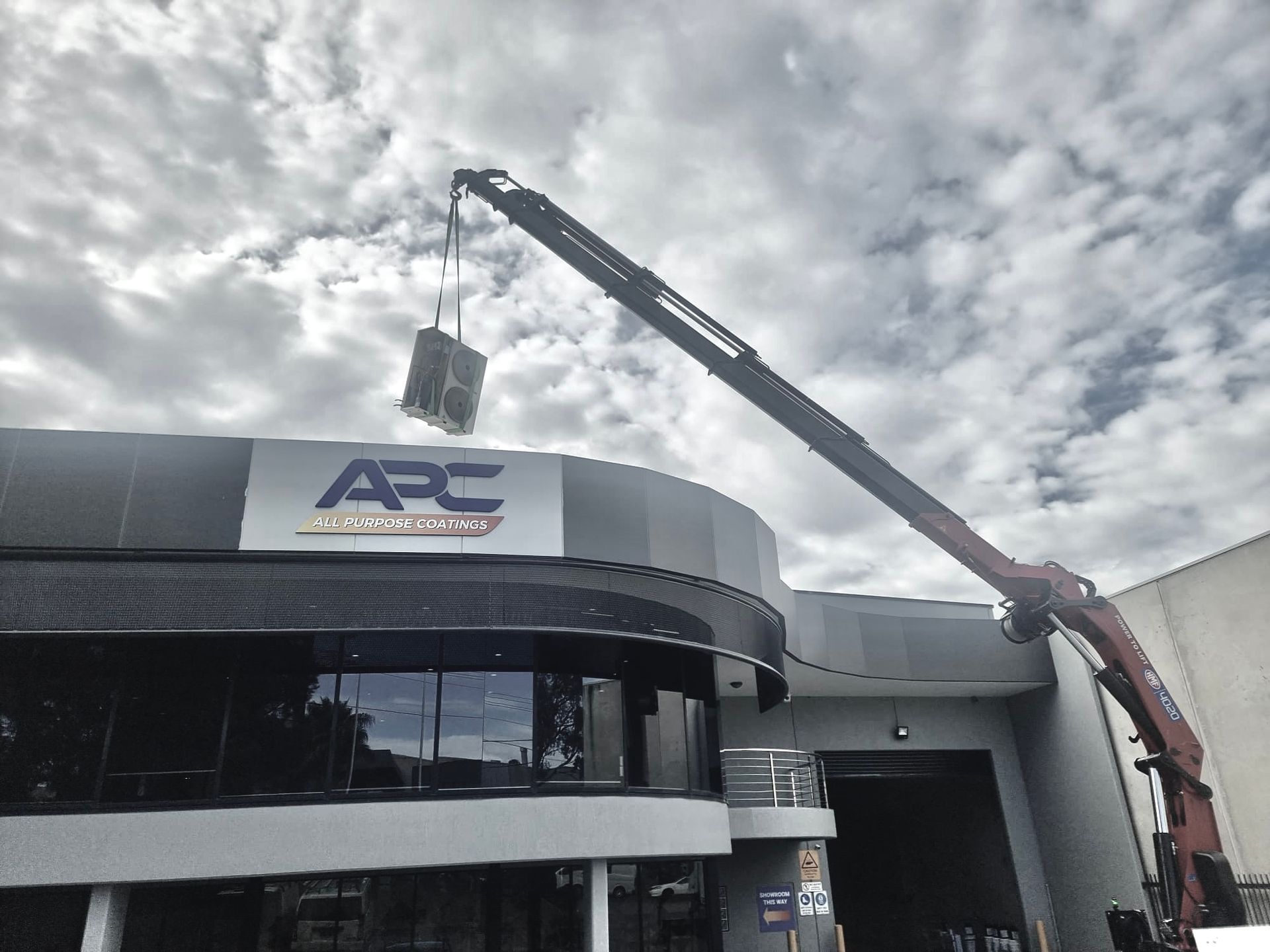 Lifting Aircon on APC Building — Sydney, NSW — Level8 Cranes