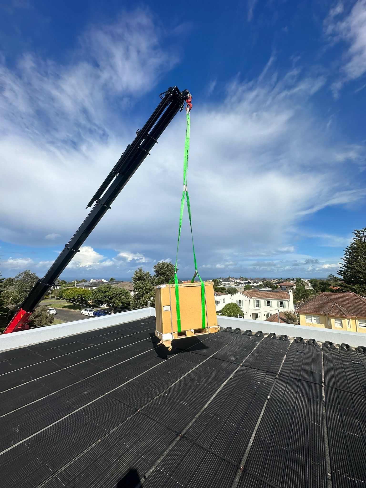 Slowly Putting Down Air Conditioning — Sydney, NSW — Level8 Cranes