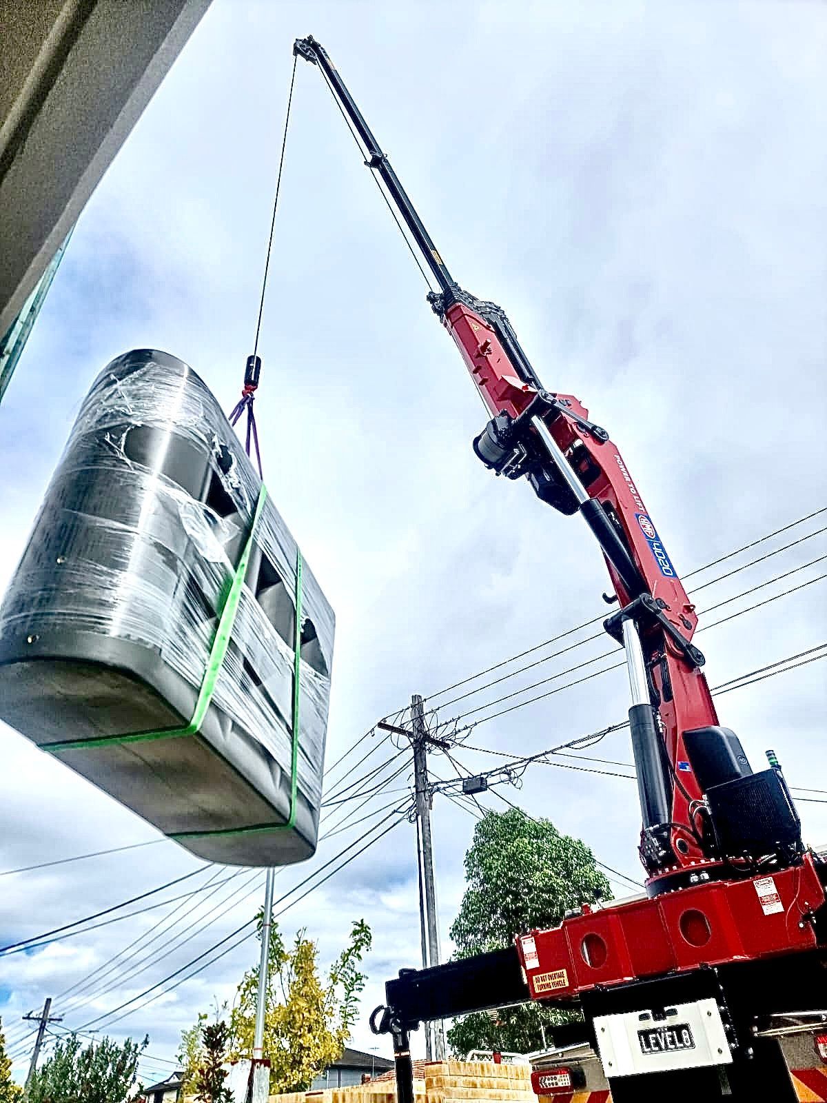 Water Tank Lifting — Sydney, NSW — Level8 Cranes