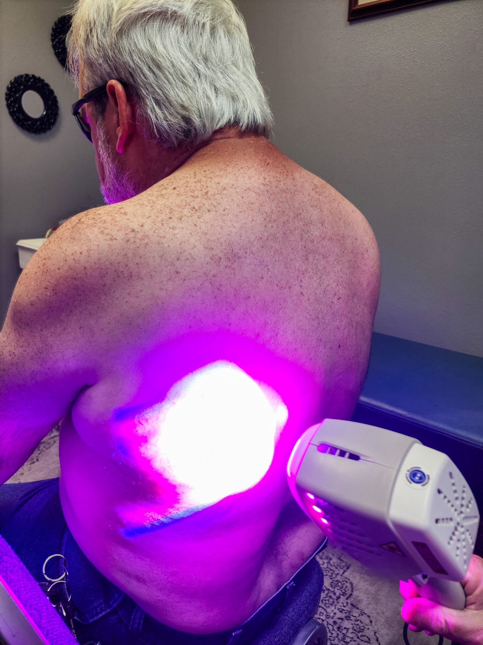 A man is getting a Firefly Light Therapy