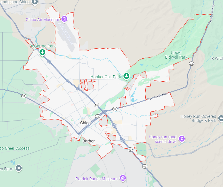 a map of a city with a lot of roads and mountains in the background .