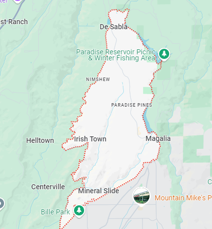 a map of a city with a lot of roads and mountains in the background .