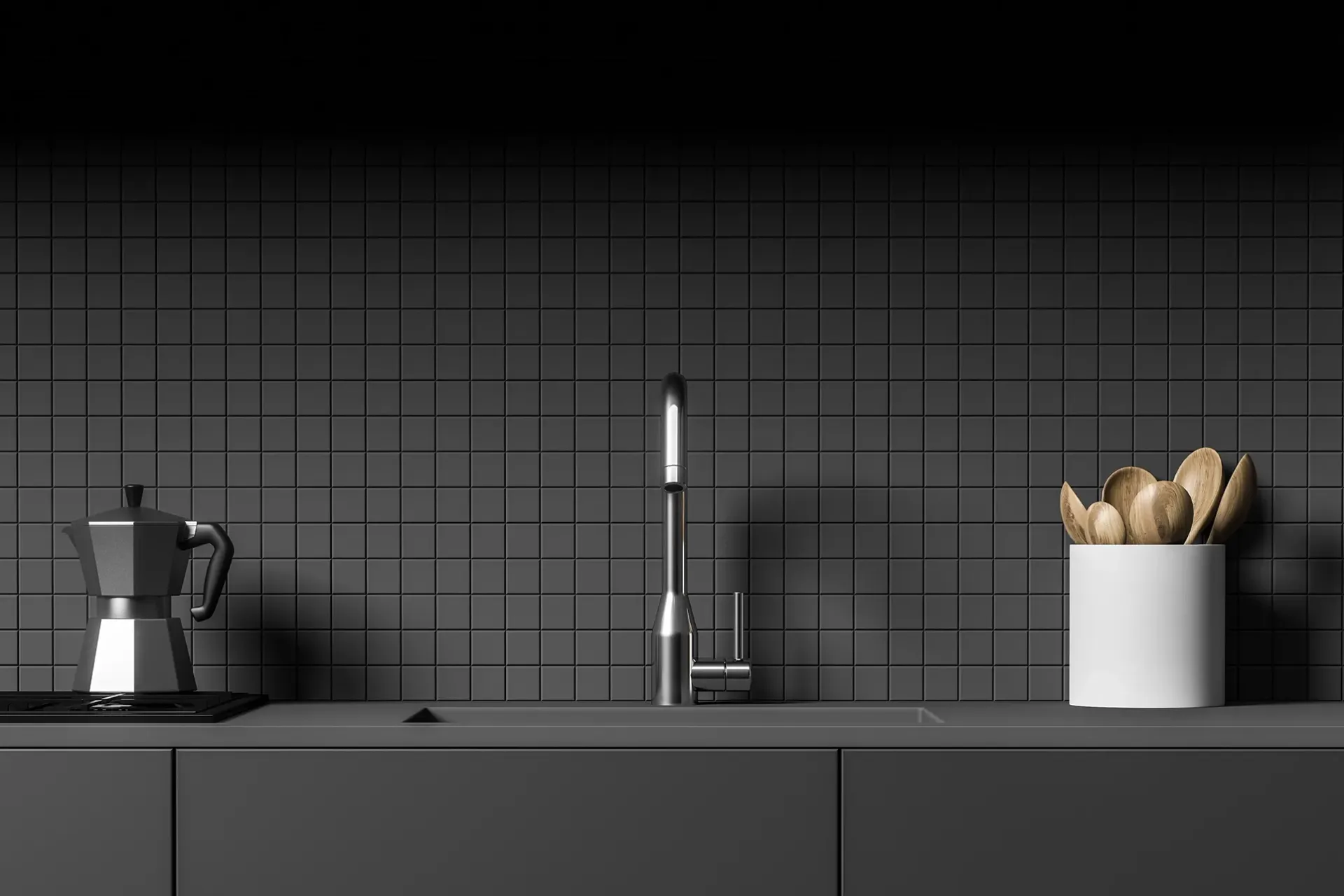 a kitchen with a sink , coffee maker , and utensils on the counter .