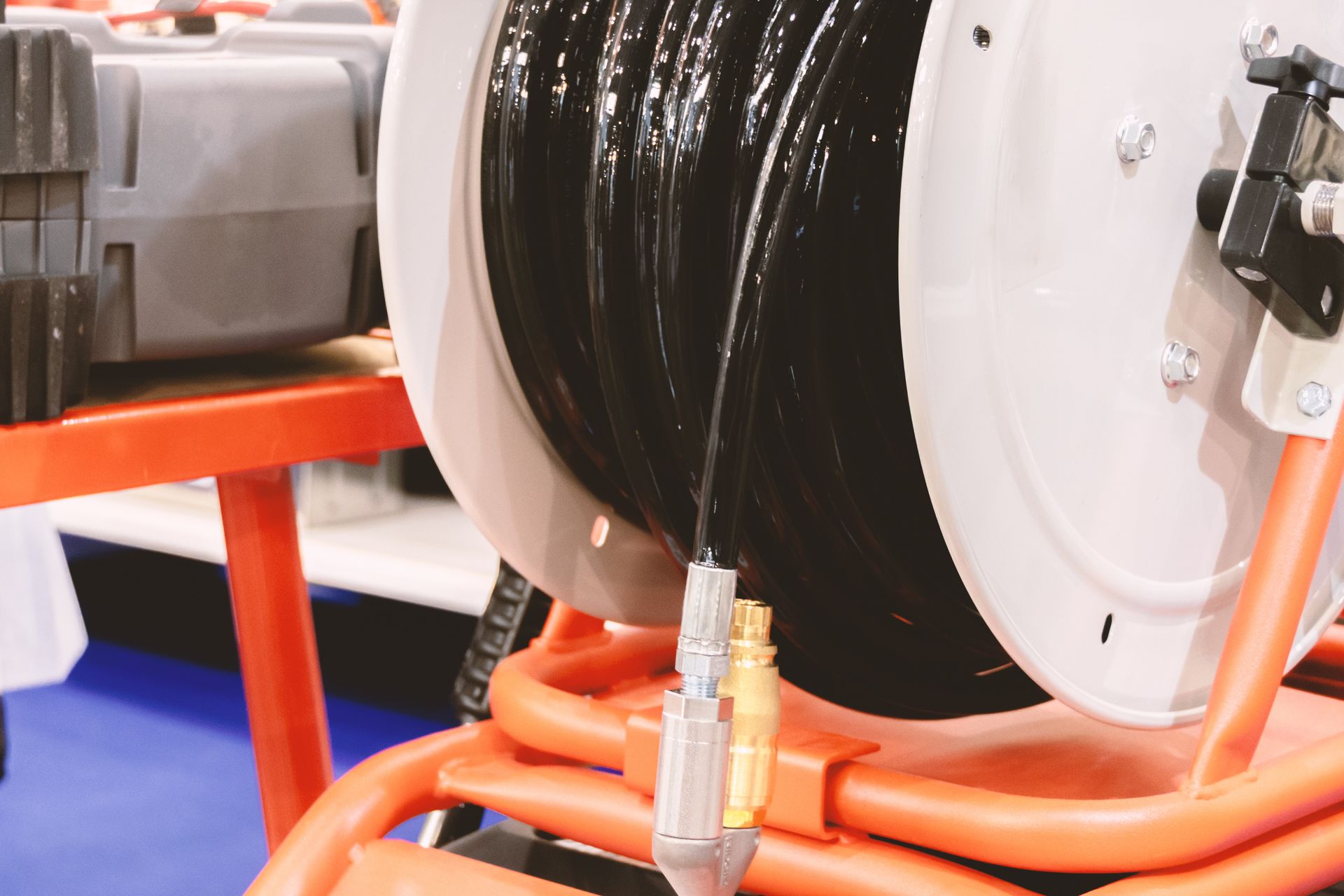 a close up of a hose reel with water coming out of it .