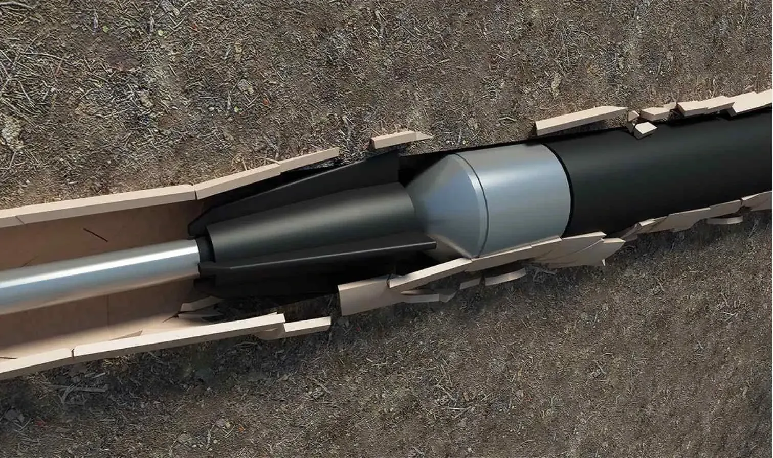 Black pipe being pulled through a broken underground pipe, using a gray tool to expand and replace it.