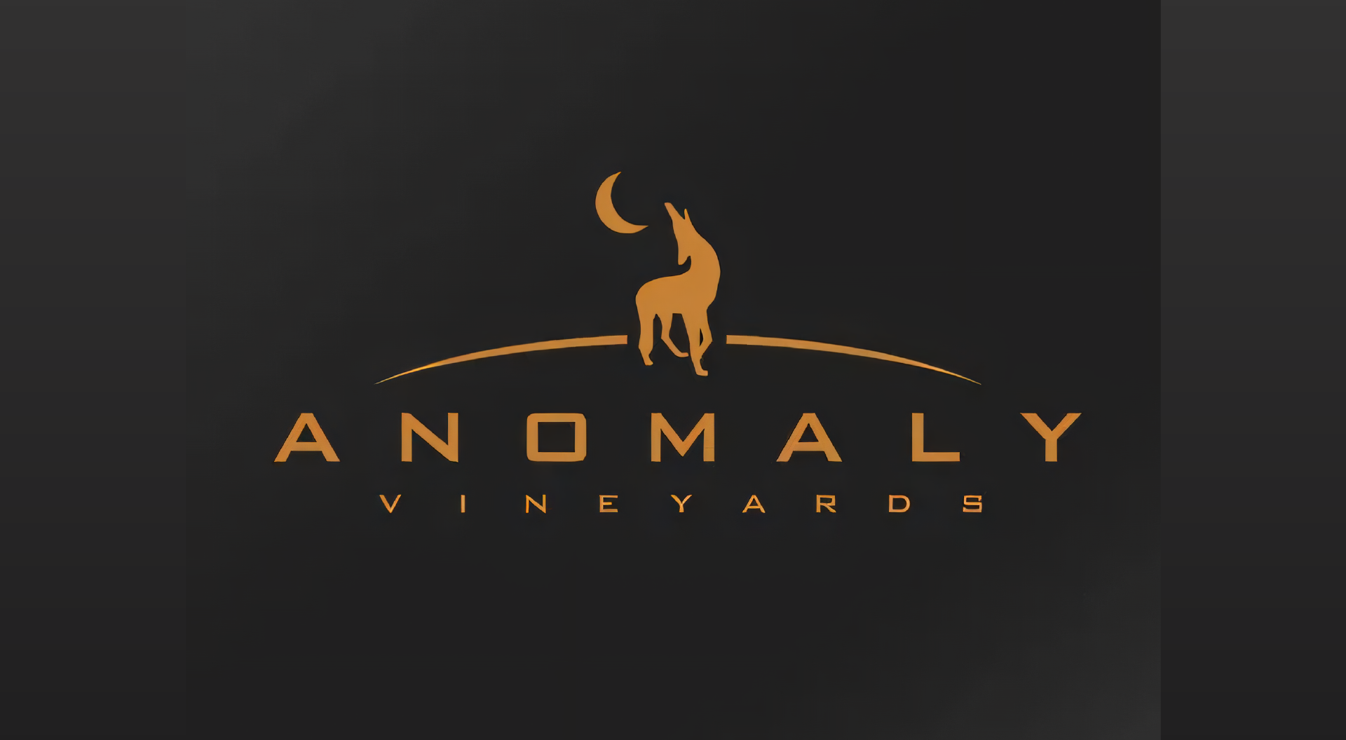 A logo for anomaly vineyards with a wolf howling at the moon