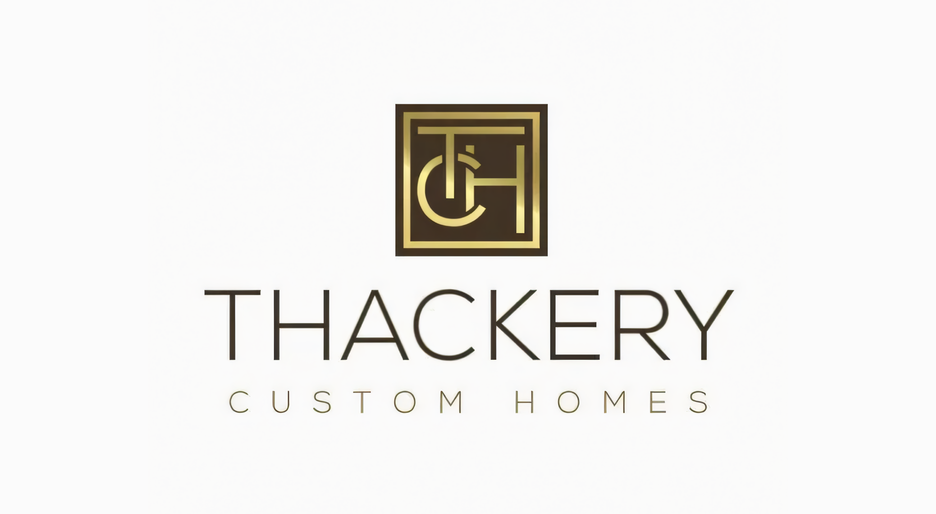A logo for a company called thackery custom homes