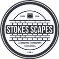 Stokes Scapes logo. Circular design with gray and white.  Text: Stokes Scapes, Landscapes, Hardscapes, Macon, Georgia, ESTD 2016.  Brick design.