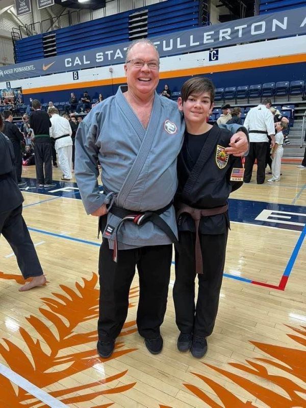 Kid and his Father photo after a karate competition.