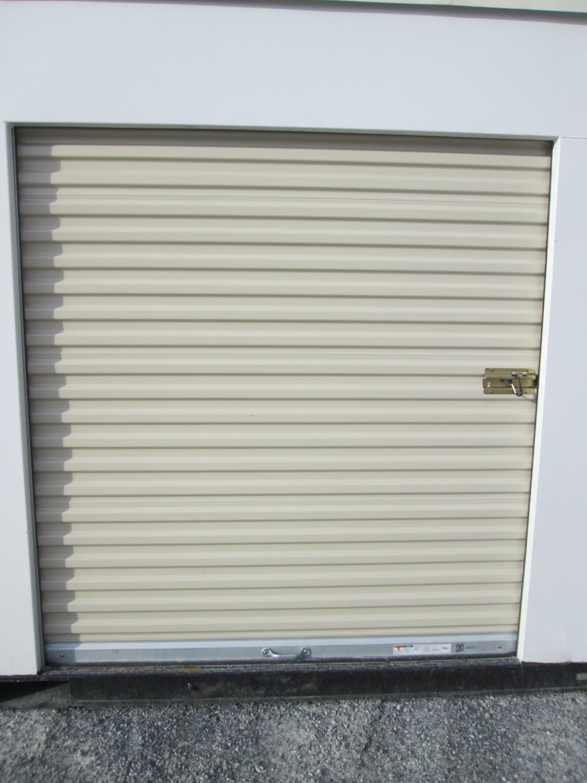 A white garage door with a lock on it — New Holland, PA — Nolts Propane Connections
