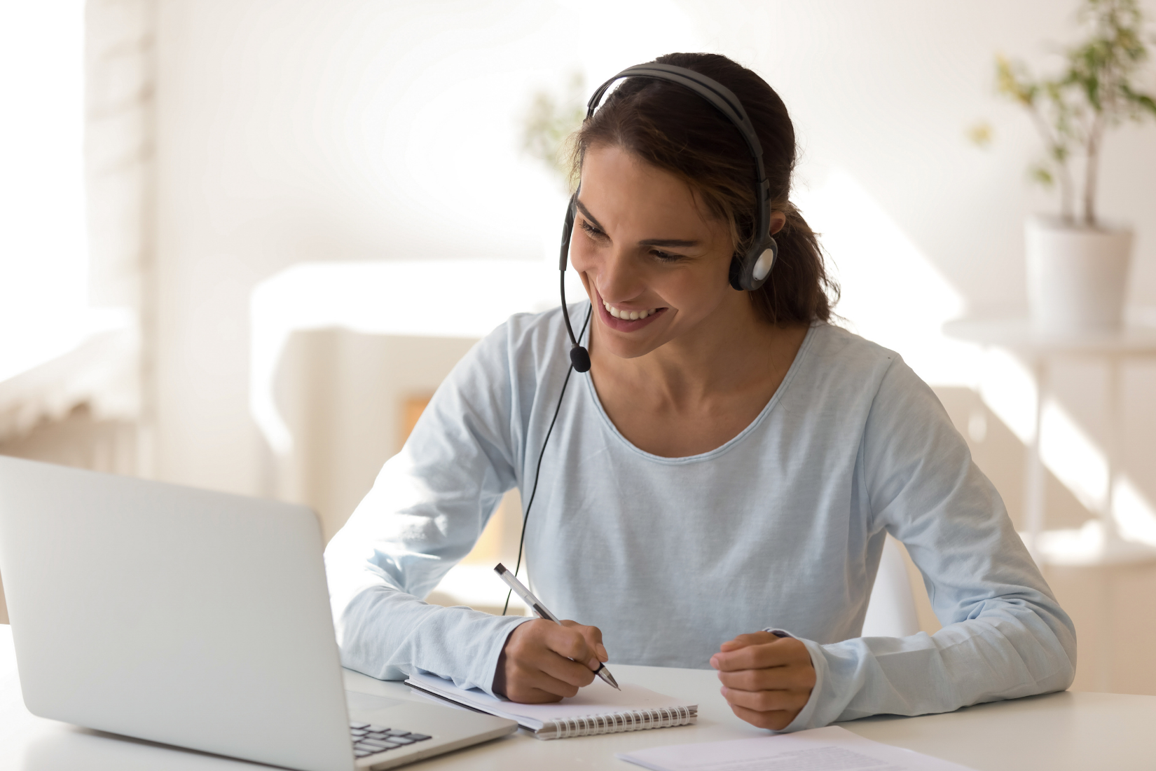 Virtual Assistant working on their laptop with a client.