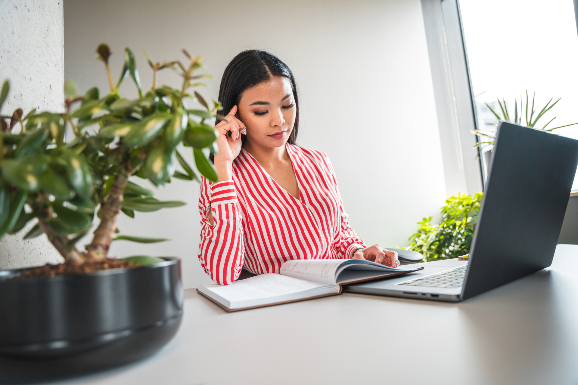 Virtual Assistant working on laptop.