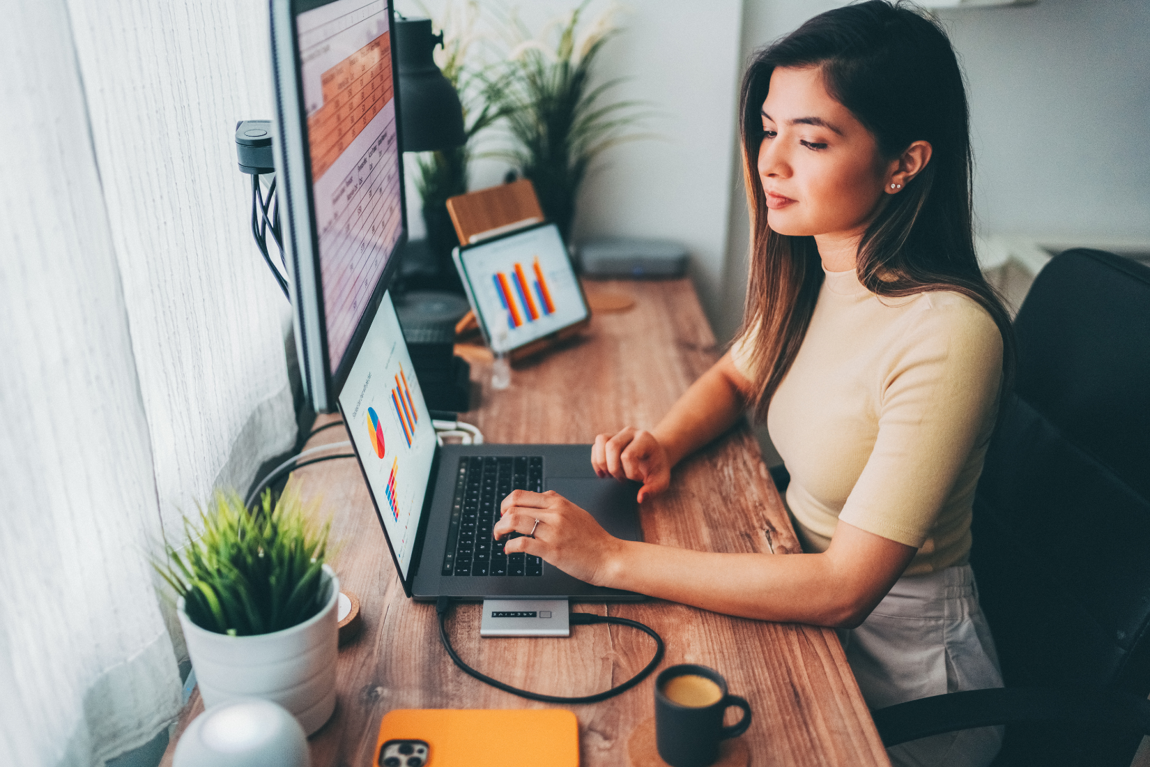 A Virtual Assistant working on a short-term project on a laptop with their client.