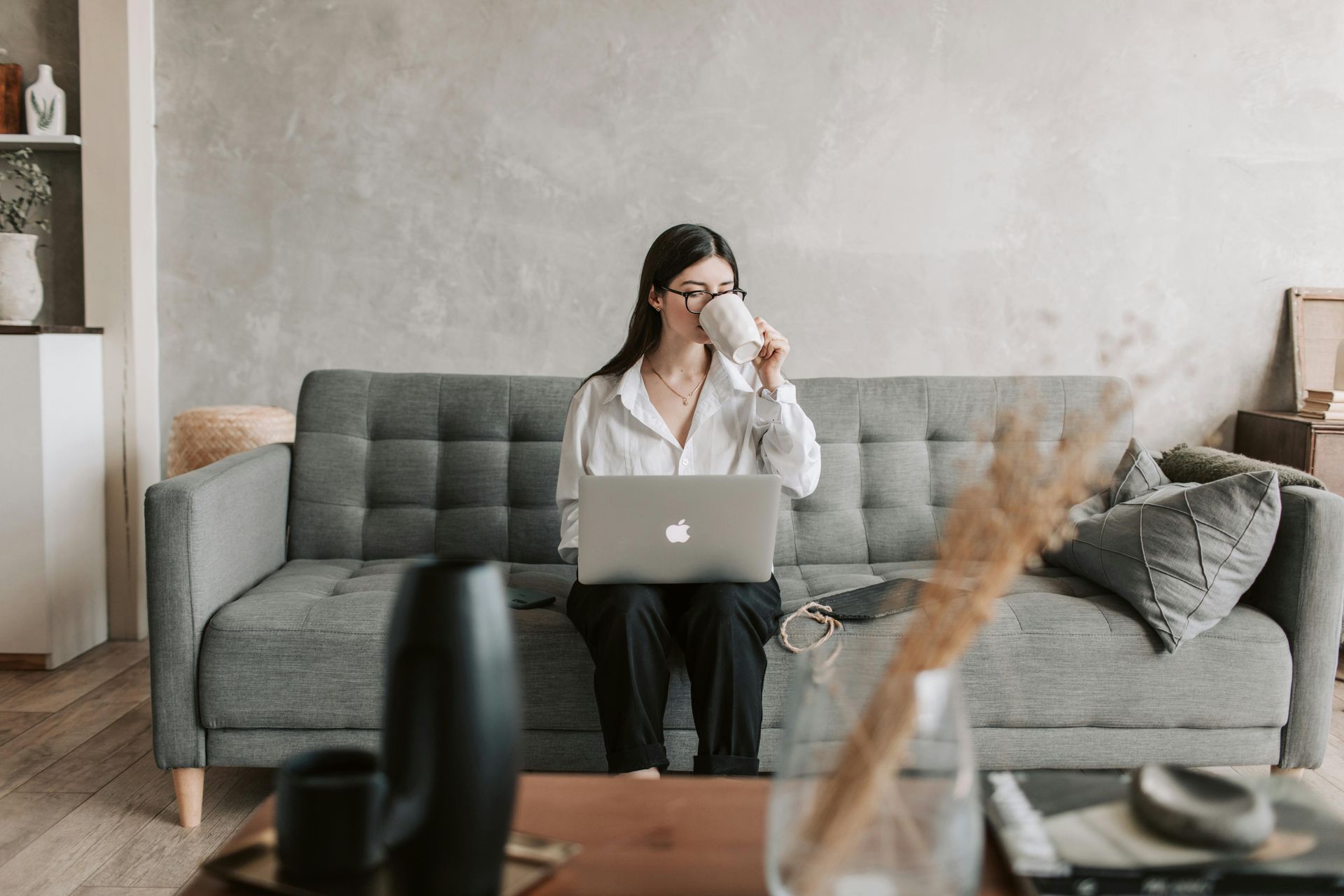 A Virtual Assistant sat working on their laptop with a client.