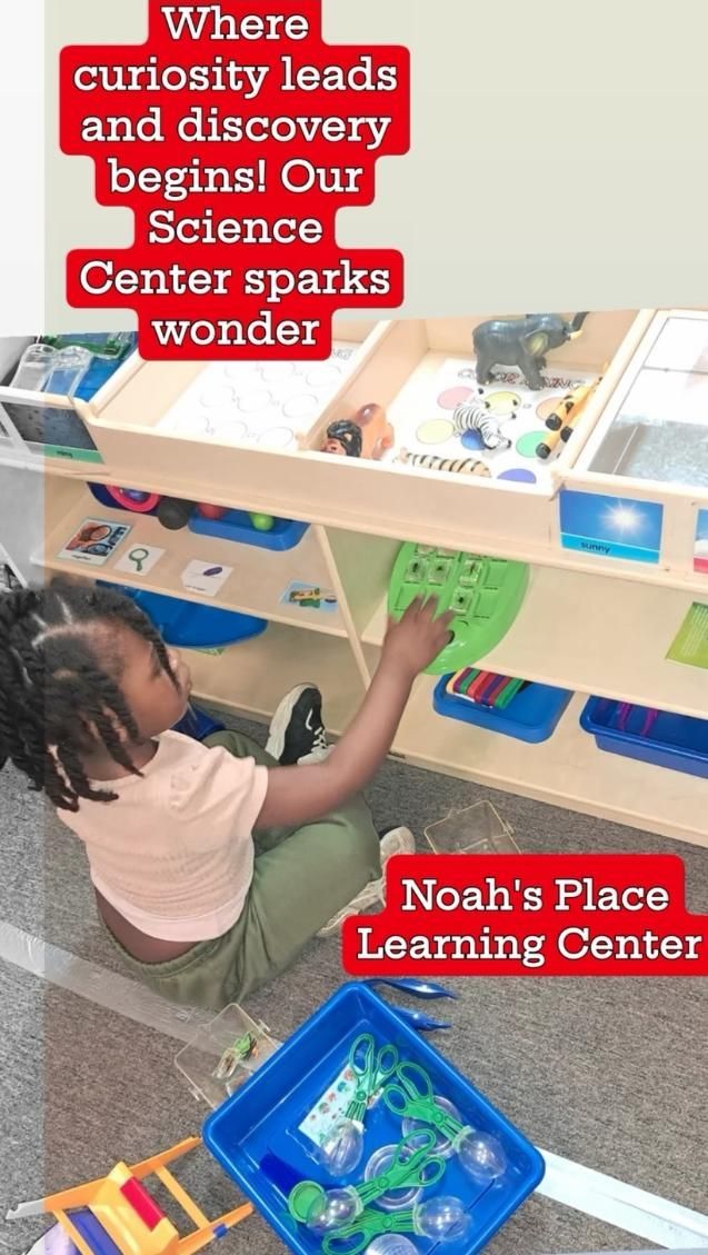A little girl is sitting on the floor playing with toys.