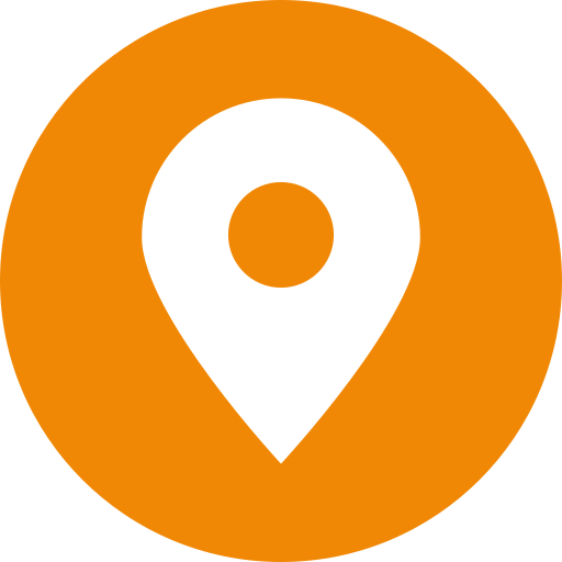 An orange circle with a white pin in it