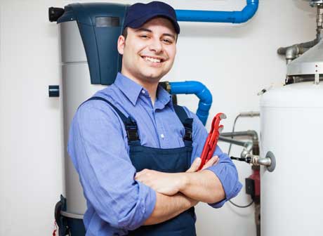 Technician Servicing an Hot Water Heater — Lubbock, TX — Ricky Boyce Plumbing, Heating & Air Conditioning