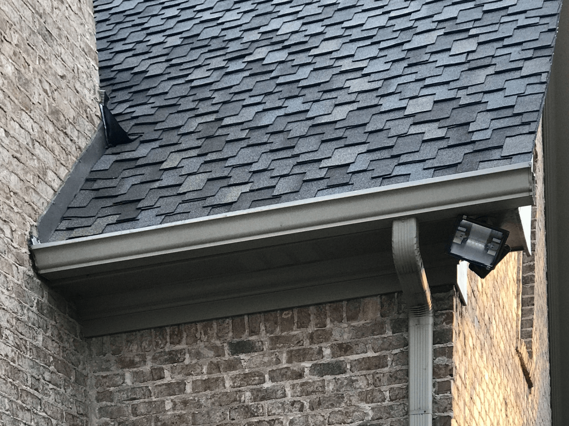 New residential gutters and roof tiling